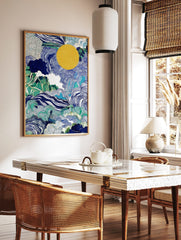 Abstract landscape wall art with blue waves, green foliage, white clouds, and a large yellow sun, in a styled room mockup