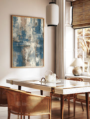 Abstract textured wall art print with layered blue, beige, and off-white brushstrokes in a vertical, in a styled room mockup