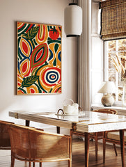 Abstract botanical wall art with stylized leaves and a red tomato in yellow, green, and navy on a, in a styled room mockup
