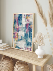 Abstract art print with blue, fuchsia, yellow, and white distressed brushstrokes and textured, in an alternate framed mockup