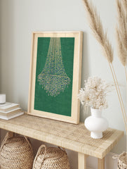 Abstract illustrative print of a chandelier-like structure with blue teardrops on beige lines, in an alternate framed mockup