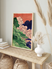 Abstract Cloud Wall Art with stylized green foliage, pink, blue, and dark clouds against an orange sky background. - Image 3