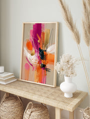 Abstract expressionist art print with fuchsia, orange, gold, and white brushstrokes and lines, in an alternate framed mockup