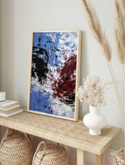 Abstract expressionist art print with blue, white, black, and red energetic brushstrokes and, in an alternate framed mockup