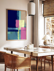 Abstract geometric art print with blocks of navy blue, teal, pink, and yellow with a distressed, in a styled room mockup