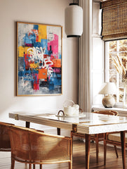Abstract graffiti wall art print with white, yellow, pink tags on layered blue, red, grey, in a styled room mockup