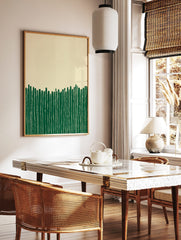 Abstract wall art print with vertical green stripes on a beige background, showing a minimalist, in a styled room mockup