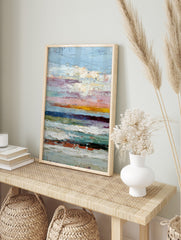 Textured abstract painting with horizontal stripes in blue, pink, yellow, white, and dark, in an alternate framed mockup