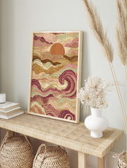 Abstract ocean sunset wall art with stylised pink, brown, and sage green waves and a large, in an alternate framed mockup