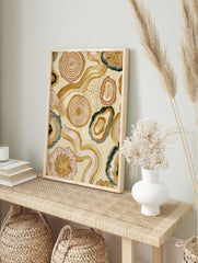 Abstract organic wall art with agate shapes, tree rings, and wavy lines in earthy beige, in an alternate framed mockup