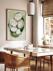 Abstract oyster shell wall art in green, white, and blush with organic shapes and dark outlines, in a styled room mockup