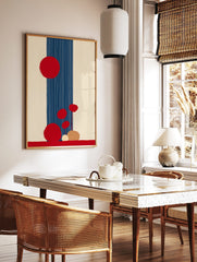 Abstract art print with large and small red circles, a navy blue vertical stripe with white lines, in a styled room mockup