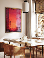 Abstract wall art with vertical red, orange, and pink colour blocks and distressed dark textures, in a styled room mockup