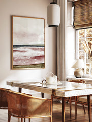 Abstract seascape art print with reddish-brown waves, dark blue ocean, green horizon, and textured, in a styled room mockup