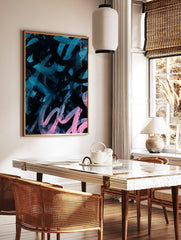 Abstract art print with bold teal and pink brushstrokes and splatters on a black background, in a, in a styled room mockup