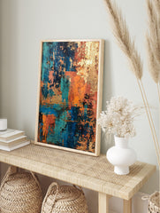 Abstract art print with distressed textures in teal, blue, orange, and gold, layered in a, in an alternate framed mockup