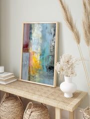 Abstract textured wall art with vertical blocks of red, yellow, blue, and grey paint on a, in an alternate framed mockup