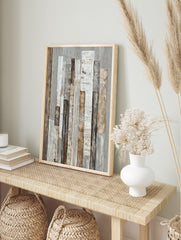Abstract textured wall art with vertical strips in white, beige, brown, and grey tones on a, in an alternate framed mockup