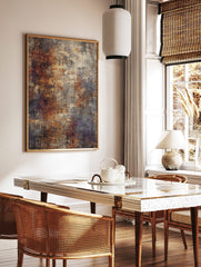 Abstract textured wall art print with rusty orange, grey, and cream tones and dark linear details, in a styled room mockup
