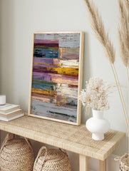 Textured abstract wall art print with horizontal blocks in purple, yellow, blue, green, and, in an alternate framed mockup