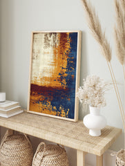 Abstract art print with distressed textures in cream, golden-yellow, deep blue, and burgundy, in an alternate framed mockup