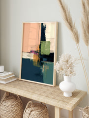 Abstract art print with blocks of peach, navy, green, ochre, and white, featuring thin black, in an alternate framed mockup