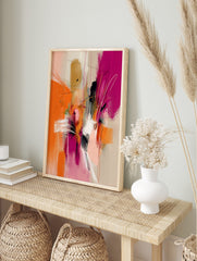 Abstract wall art print with dynamic orange, fuchsia, black, and white brushstrokes and, in an alternate framed mockup