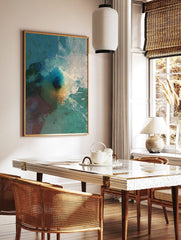Abstract art print with textured deep blue, teal, orange, and white paint strokes and splashes, in a styled room mockup