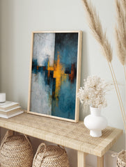 Abstract wall art print with textured blue-teal, yellow, and white intersecting shapes and, in an alternate framed mockup