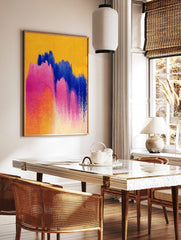 Abstract art print with broad pink, blue, and orange watercolour brushstrokes on a yellow background, in a styled room mockup