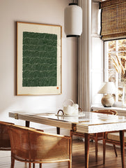 Abstract green wave pattern print with repeating lines on a cream background, in a styled room mockup