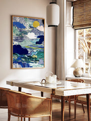 Abstract blue and green wavy landscape art print with stylised clouds and a golden sun, in a styled room mockup