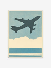 Vintage airplane poster featuring a dark silhouette of a plane flying in a blue sky above clouds and water, with a halftone texture.