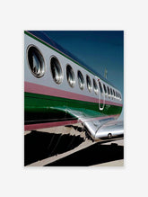 Close-up of an airplane's silver and green fuselage with windows, a modern aviation photography wall art print.