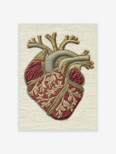 Anatomical heart embroidered style art print with red and gold vessels on beige background