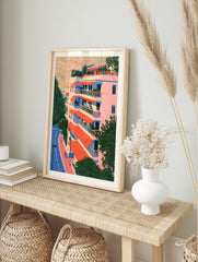 Architectural illustration of a residential building with orange awnings, balconies, and a, in an alternate framed mockup