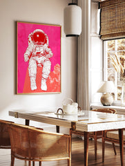 Illustrative astronaut in white space suit against a vibrant pink and red textured background, with, in a styled room mockup