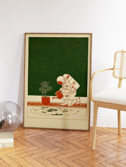 Astronaut wall art illustration showing an astronaut in a spacesuit watering a small potted plant on a beige floor. - Image 2
