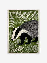 Illustrated badger art print in a forest with green foliage and white ferns, featuring a black and white badger.
