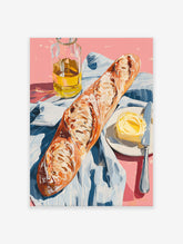 A poster depicting a still life of a baguette, a pat of butter with a knife on a plate, and a bottle of olive oil on a pink surface with a blue and white striped cloth.