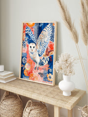 Illustrative barn owl in flight with blue and white wings against a coral and blue patterned, in an alternate framed mockup