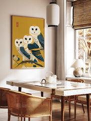 Three barn owls with white faces and blue-gold feathers perched on a branch on a golden background in Japanese art style. - Image 2