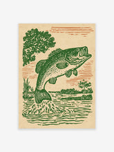 Vintage green bass fish jumping from water illustration print with trees and water reeds in a rustic art style.