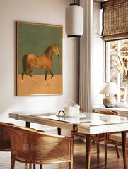 Illustrative bay horse walking in profile against a two-tone teal and beige background art print, in a styled room mockup