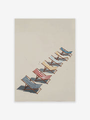 Beach chairs poster with blue, red, and yellow striped chairs lined up on a beige sandy beach under sunlight.