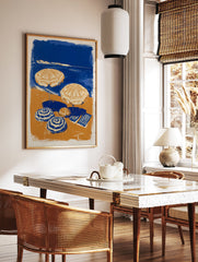 Blue and orange beach scene poster with two open umbrellas, two closed umbrellas, and a striped towel on the sand next to the ocean. - Image 2
