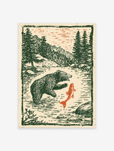 Vintage style illustration of a bear catching a red fish in a river with green pine trees and mountains in the background.