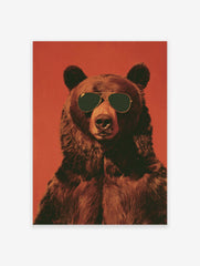Close-up poster of a brown bear wearing aviator sunglasses, set against a textured red-orange background.