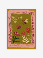 Illustrative bee and flower wall art print with a pink border on an olive green background, featuring botanical elements.