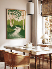 Illustrative wall art of birch trees with green leaves, a winding stream, reeds, and three ducks, in a styled room mockup